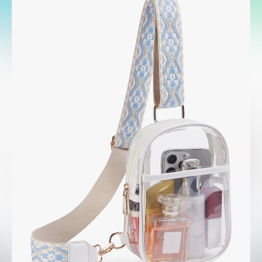 New with tags and in original packaging - clear bag - great for concerts!